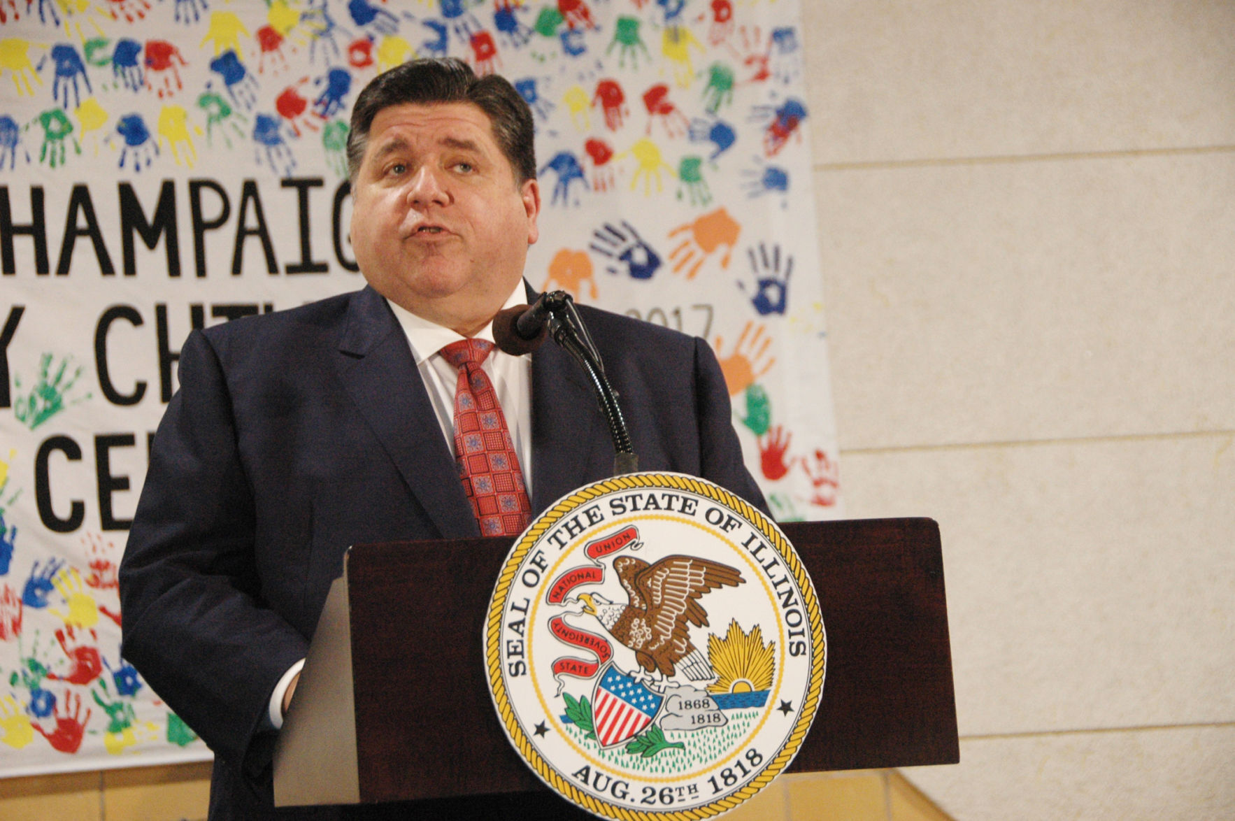 Pritzker at podium